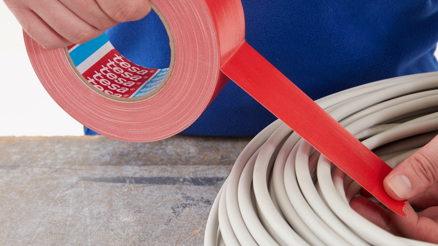 tesa® 4688 Standard polyethylene coated cloth tape - tesa-4688-standard-polyethylene-coated-cloth-tape-red-step1of5-ap.jpg